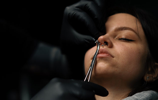 Piercing process on a young girl